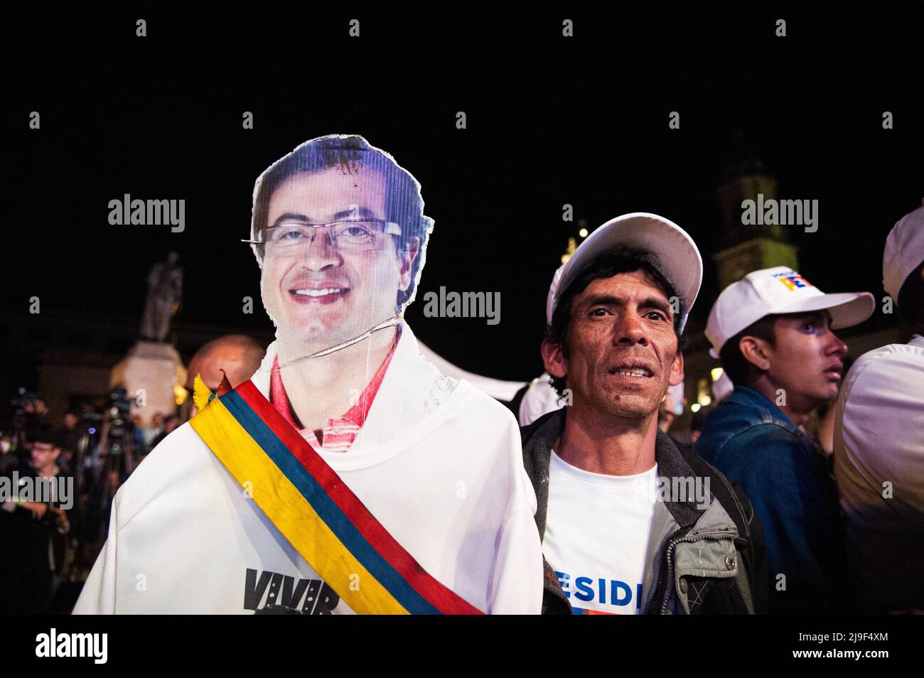 A supporter carries a cut-out carboard figure of presidential candidate Gustavo Petro during the closing campaign rally of left-wing presidential cand Stock Photo