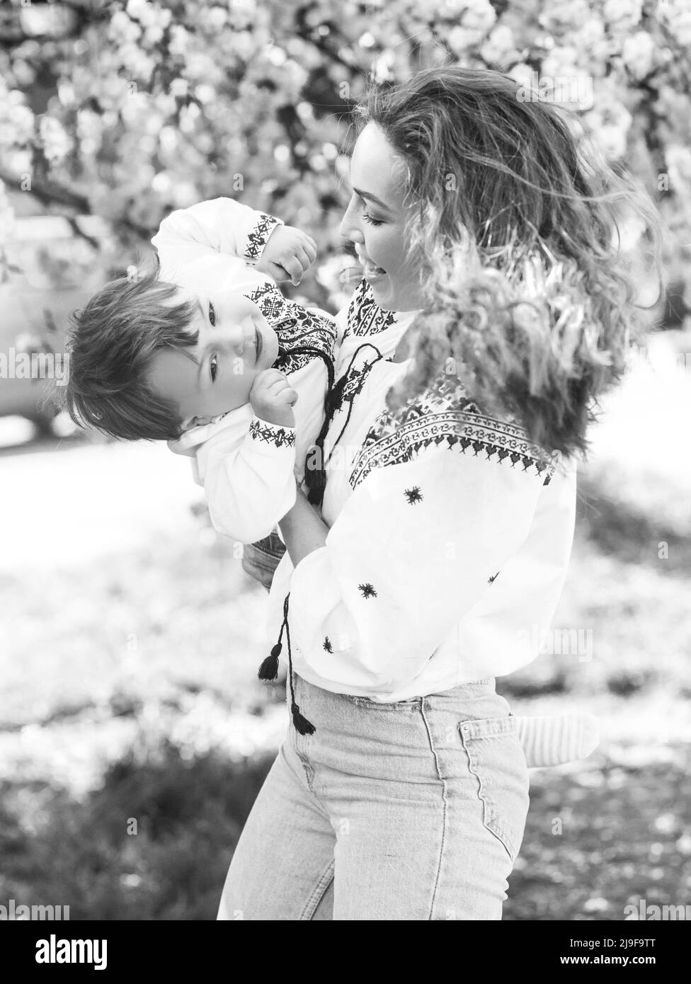 Black and white photo of mom and son. Portrait of two people. Mother's day spring concept Stock Photo