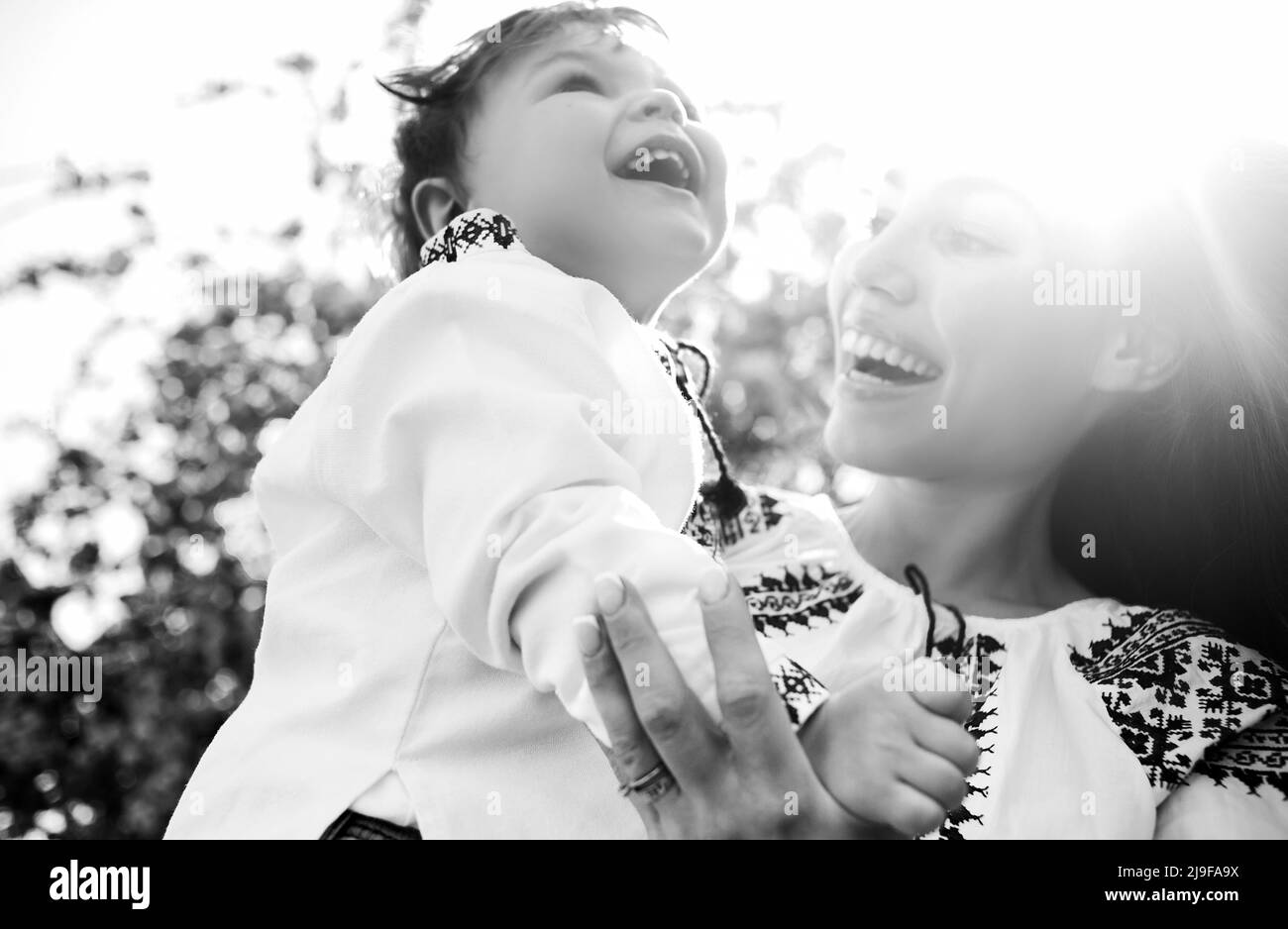 Black and white photo of mom and son. Portrait of two people. Mother's day spring concept Stock Photo