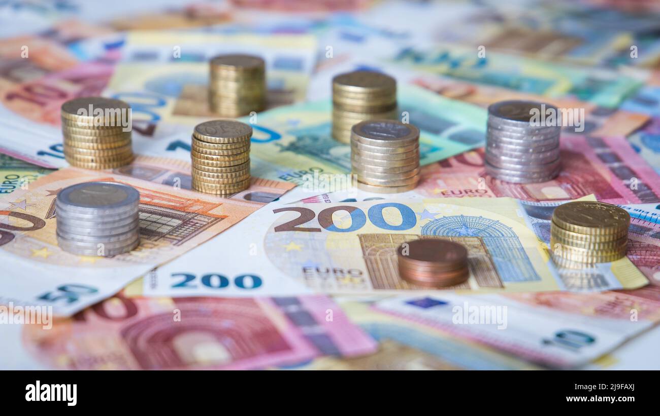 A combination of different Euro banknotes and Euro coins as a closeup Stock Photo