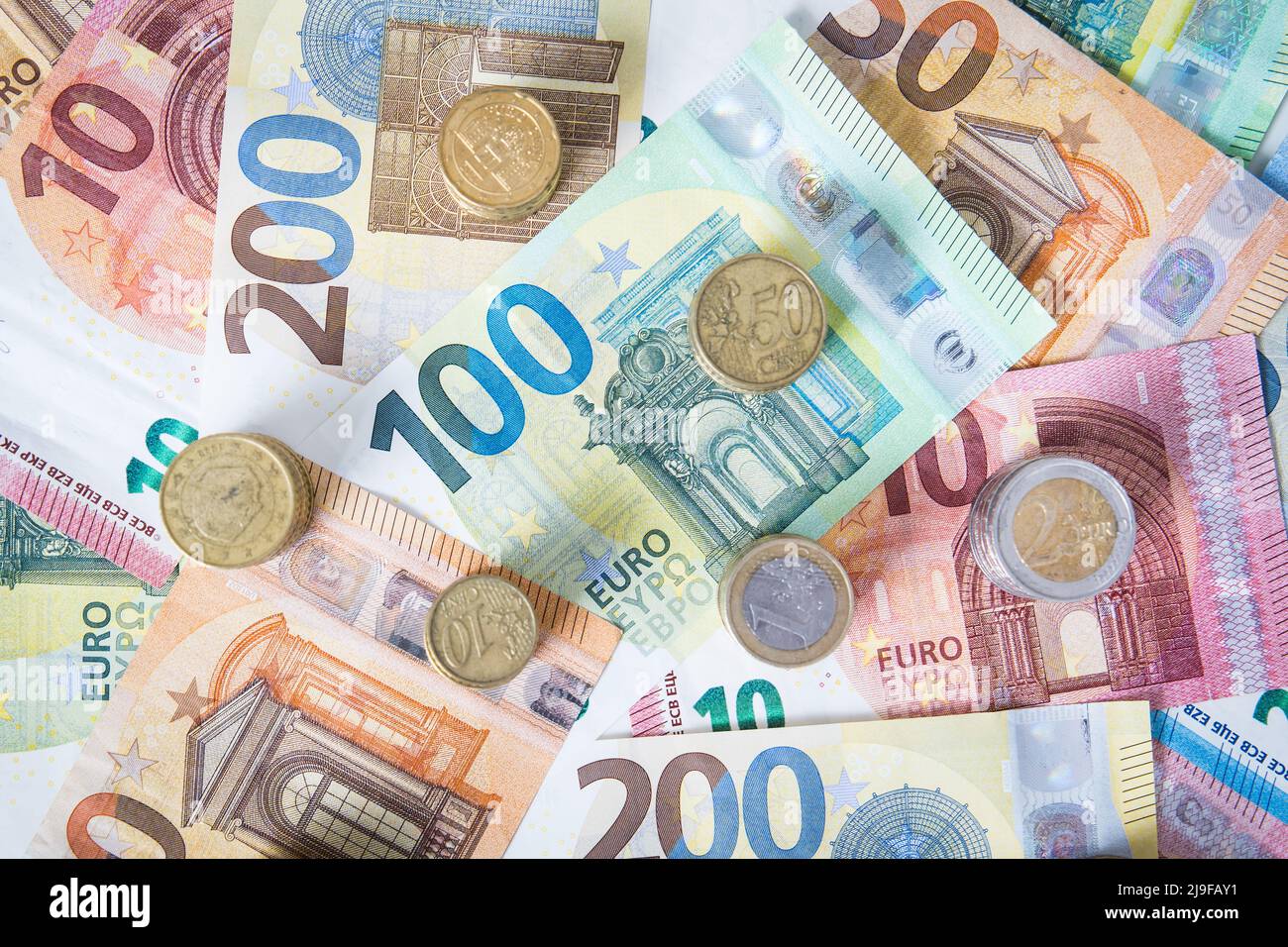 A combination of different Euro banknotes and Euro coins as a closeup Stock Photo