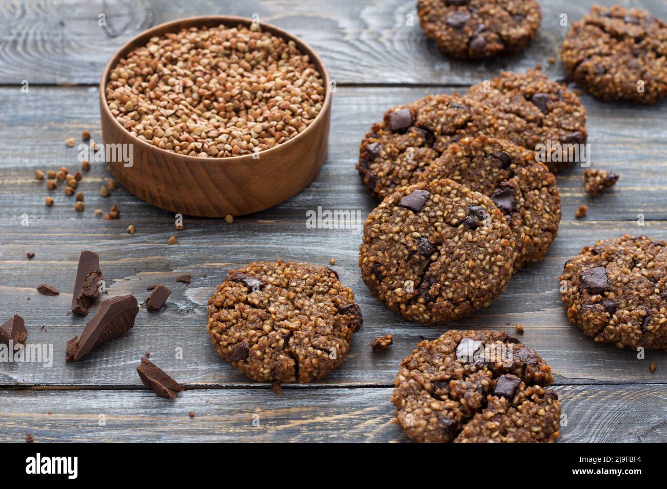 Healthy gluten-free buckwheat cookies with chocolate on a wooden table Stock Photo