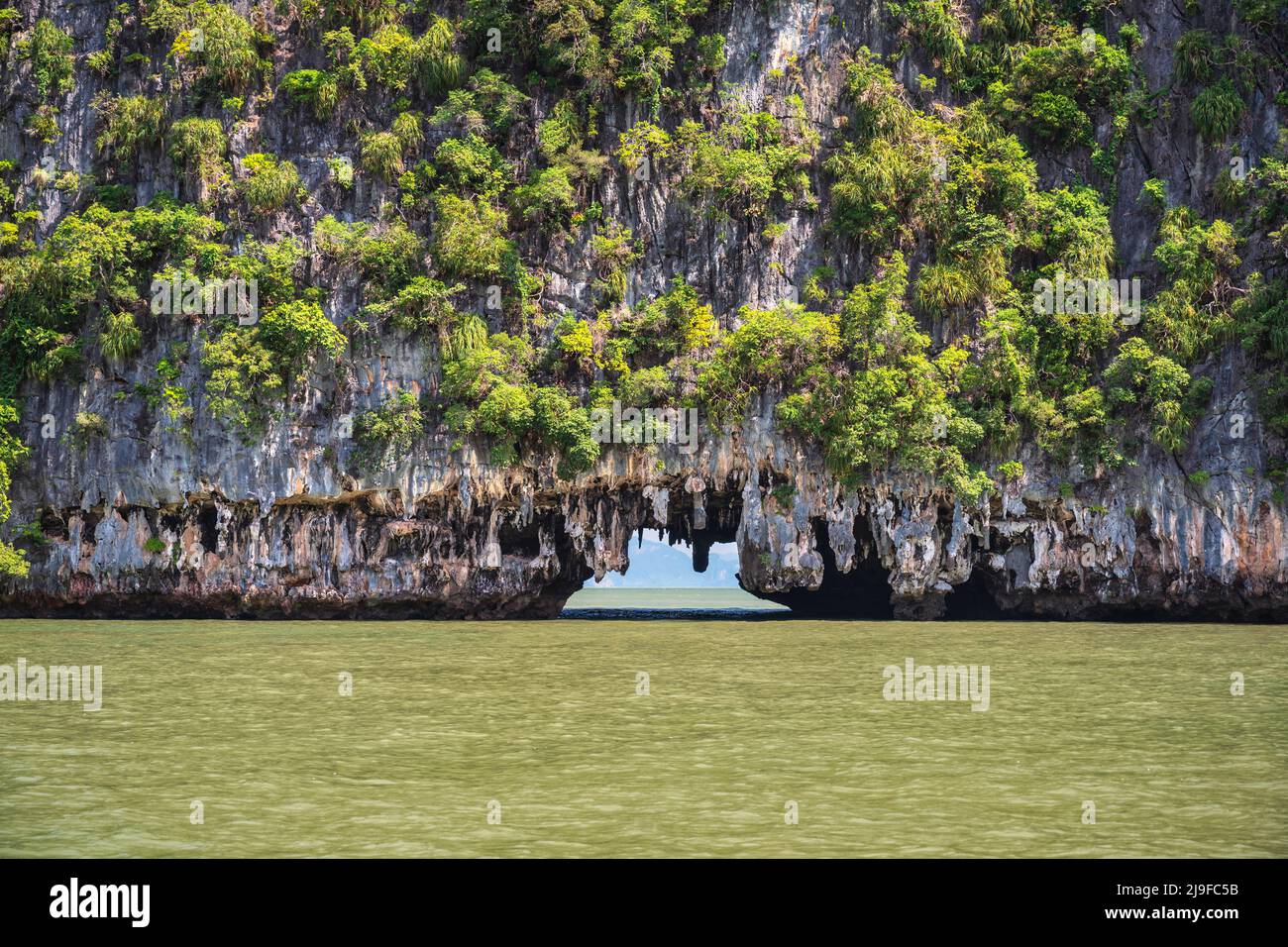 Tropical islands view at Tham Lod Cave with ocean blue sea water, Phang Nga Thailand nature landscape Stock Photo
