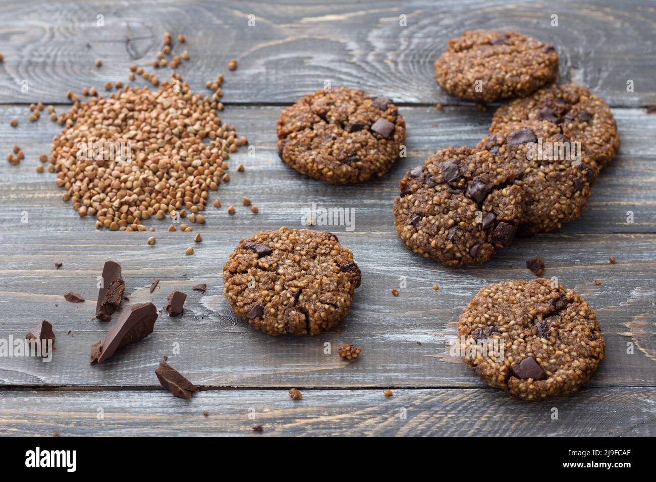 Healthy gluten-free buckwheat cookies with chocolate on a wooden table Stock Photo