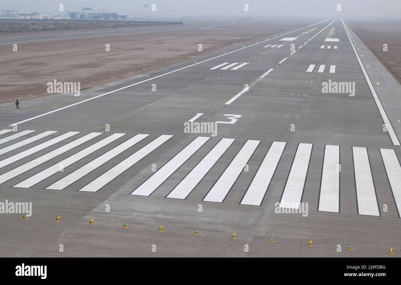 Airfield, aircraft take-off runway, aircraft take-off apron, asphalt road where jets prepare to fly, airline vehicles. Stock Photo