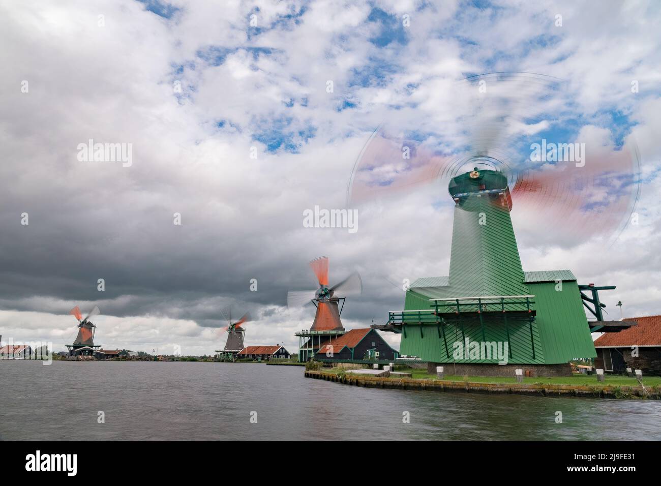 Traditional dutch windmill near the canal. Netherlands Stock Photo