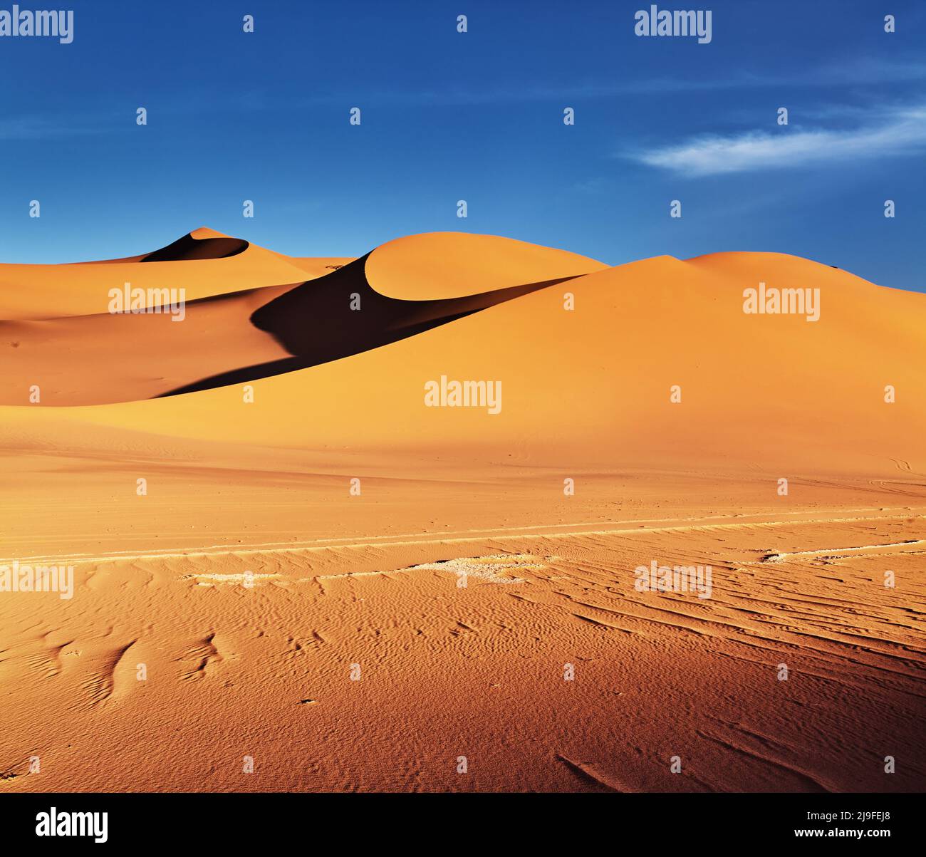 Great sand dunes of Sahara Desert at sunset in Algeria Stock Photo