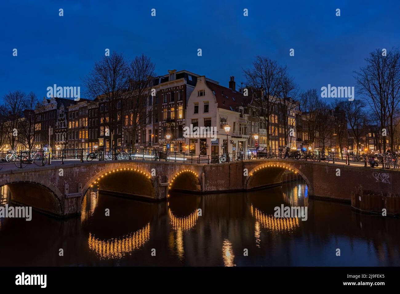 Amsterdam, Netherlands bridges and canals at twilight.  Stock Photo