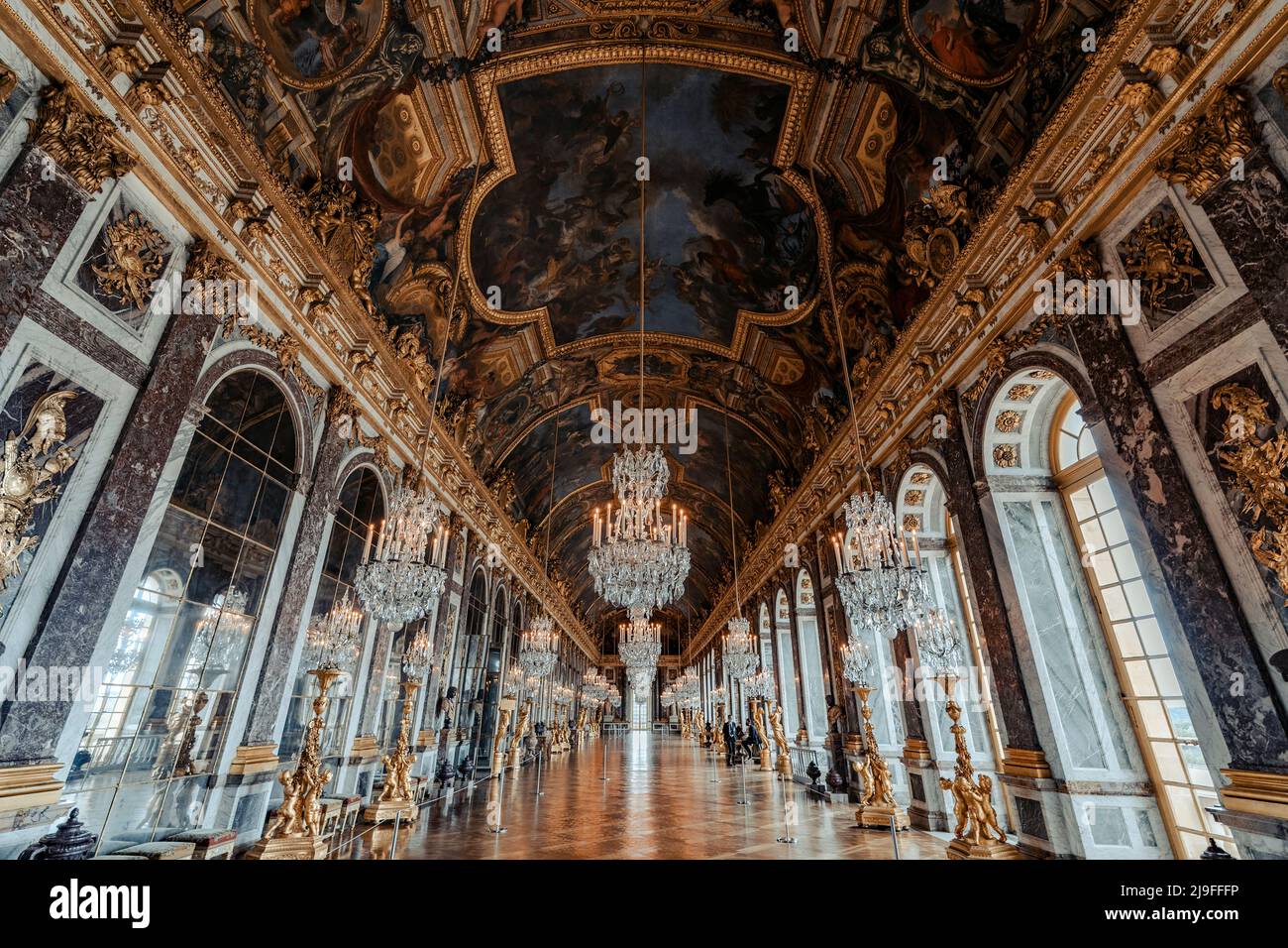 VERSAILLES, FRANCE - MAY 20 2022: The Hall of Mirrors (Galerie des Glaces) of the Royal Palace of Versailles in France Stock Photo
