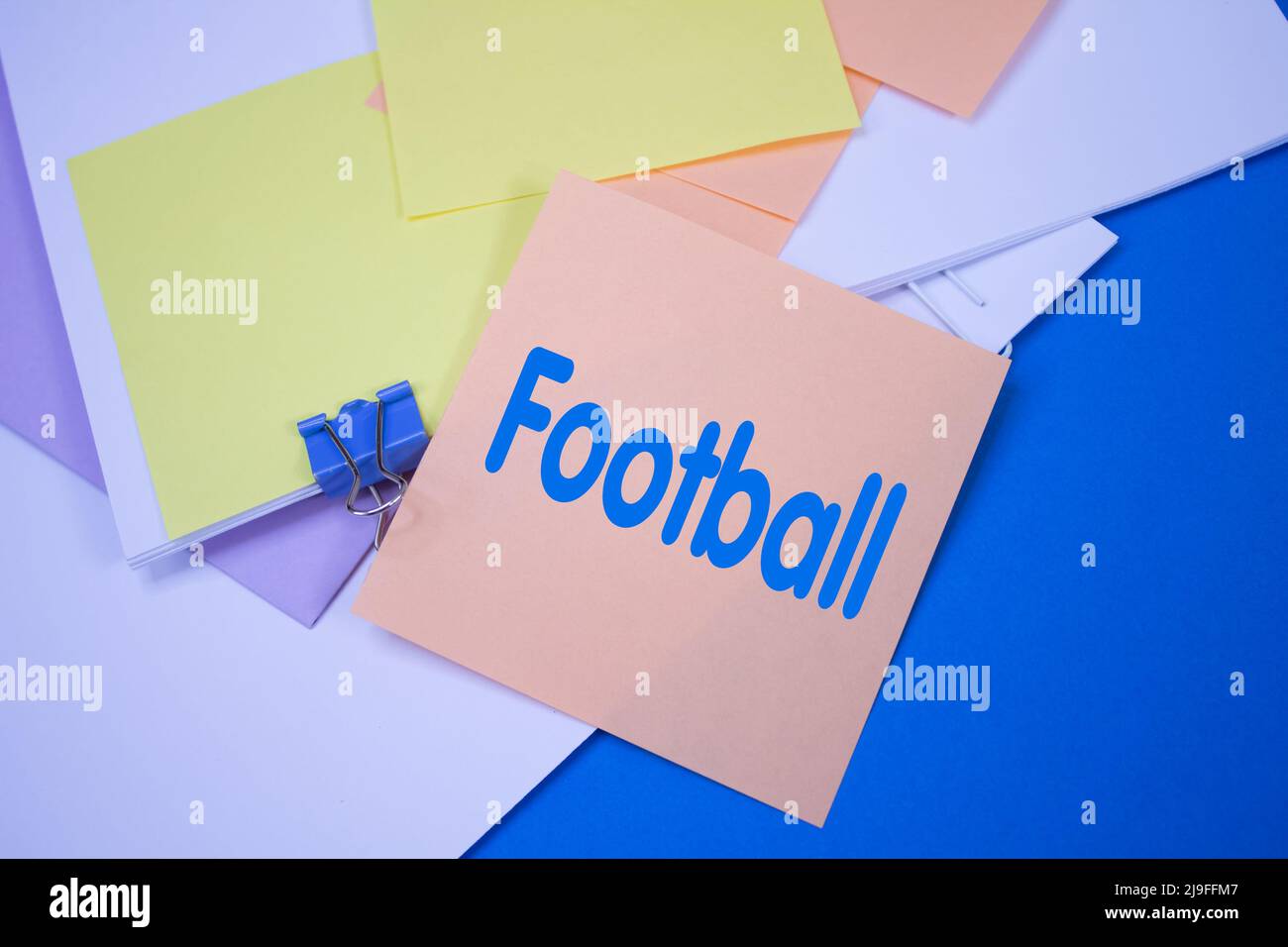 Football. Text on adhesive note paper. Event, celebration reminder message. Stock Photo