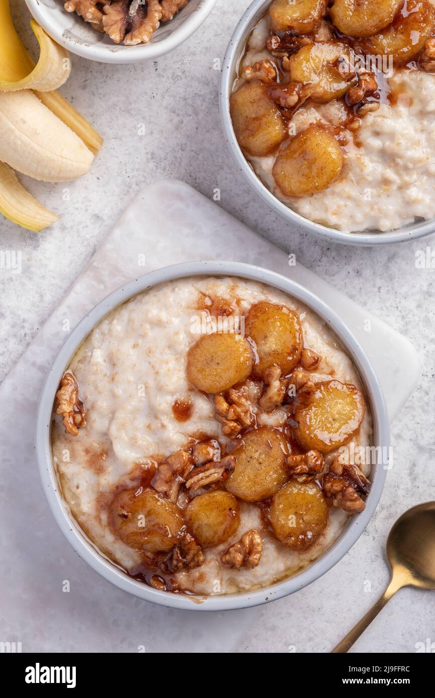 Porridge with caramelised banana and nuts Stock Photo Alamy