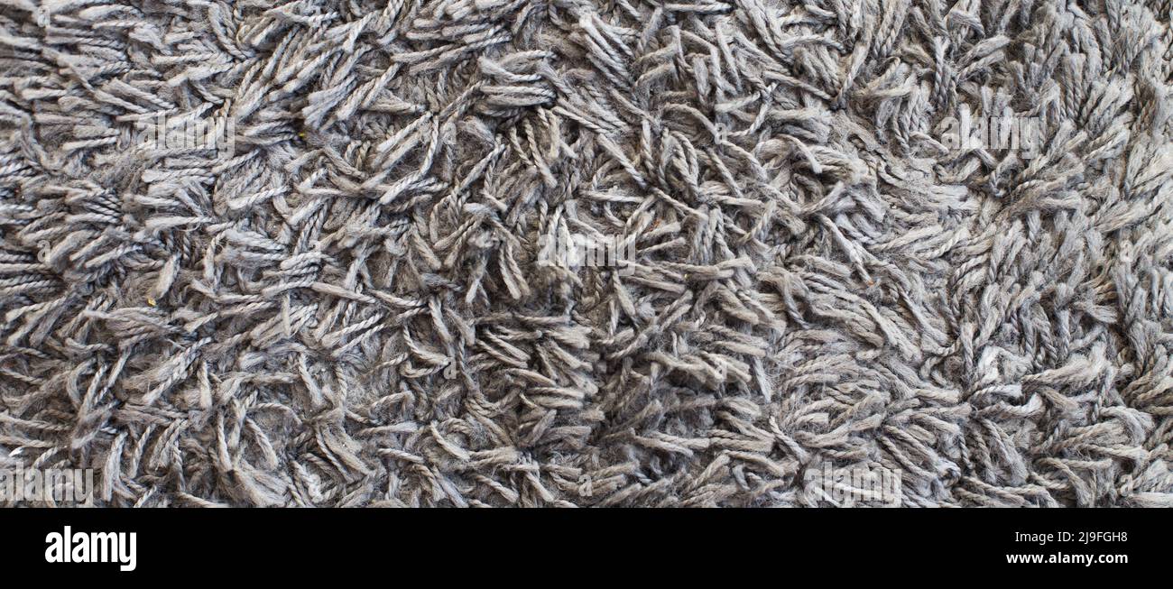 The texture of gray carpet. Fleecy surface background. Stock Photo