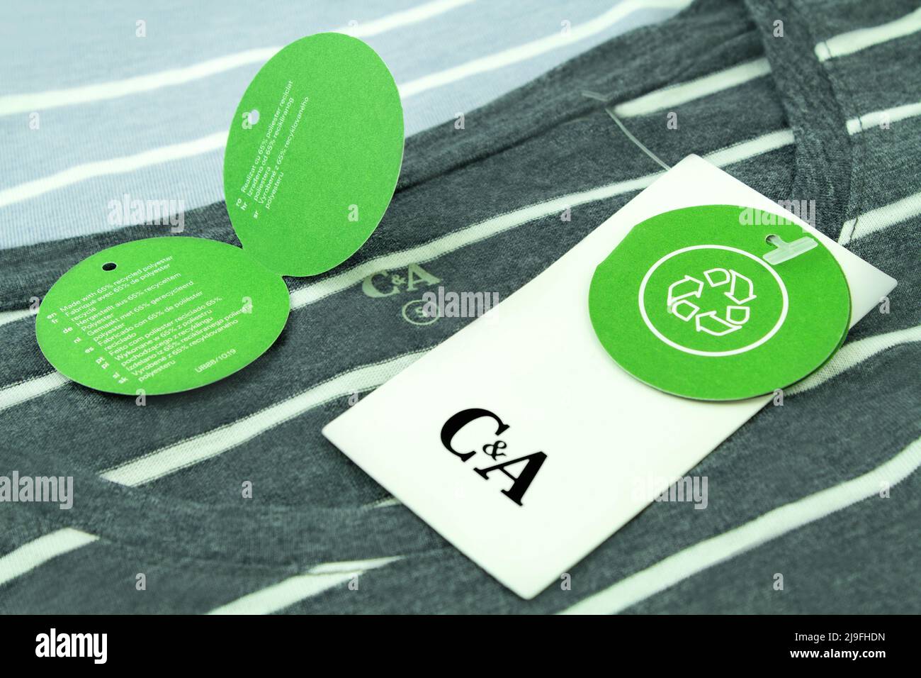 Hamburg, Germany -  May 20  2022:  Fashion and green Polyester Recycling Label C&A with T-Shirt Stock Photo