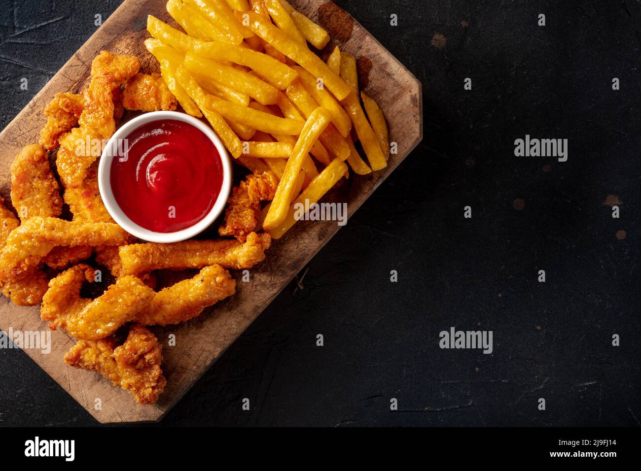 Chicken tenders, battered and fried crispy wedges, with a bbq sauce and ...