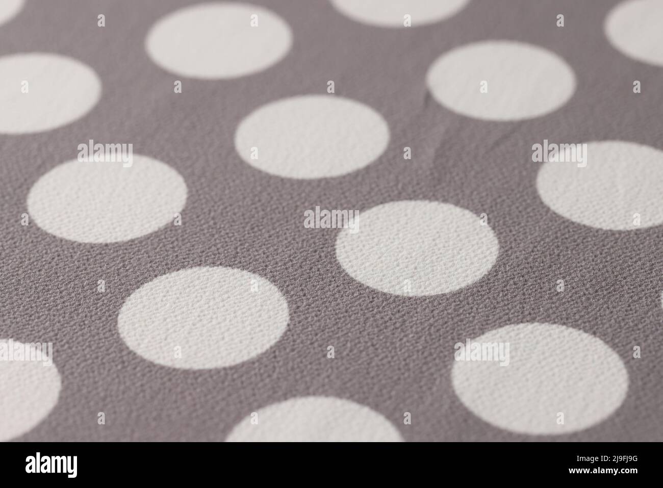 Fabric beige in white circles closeup. Texture background Stock Photo