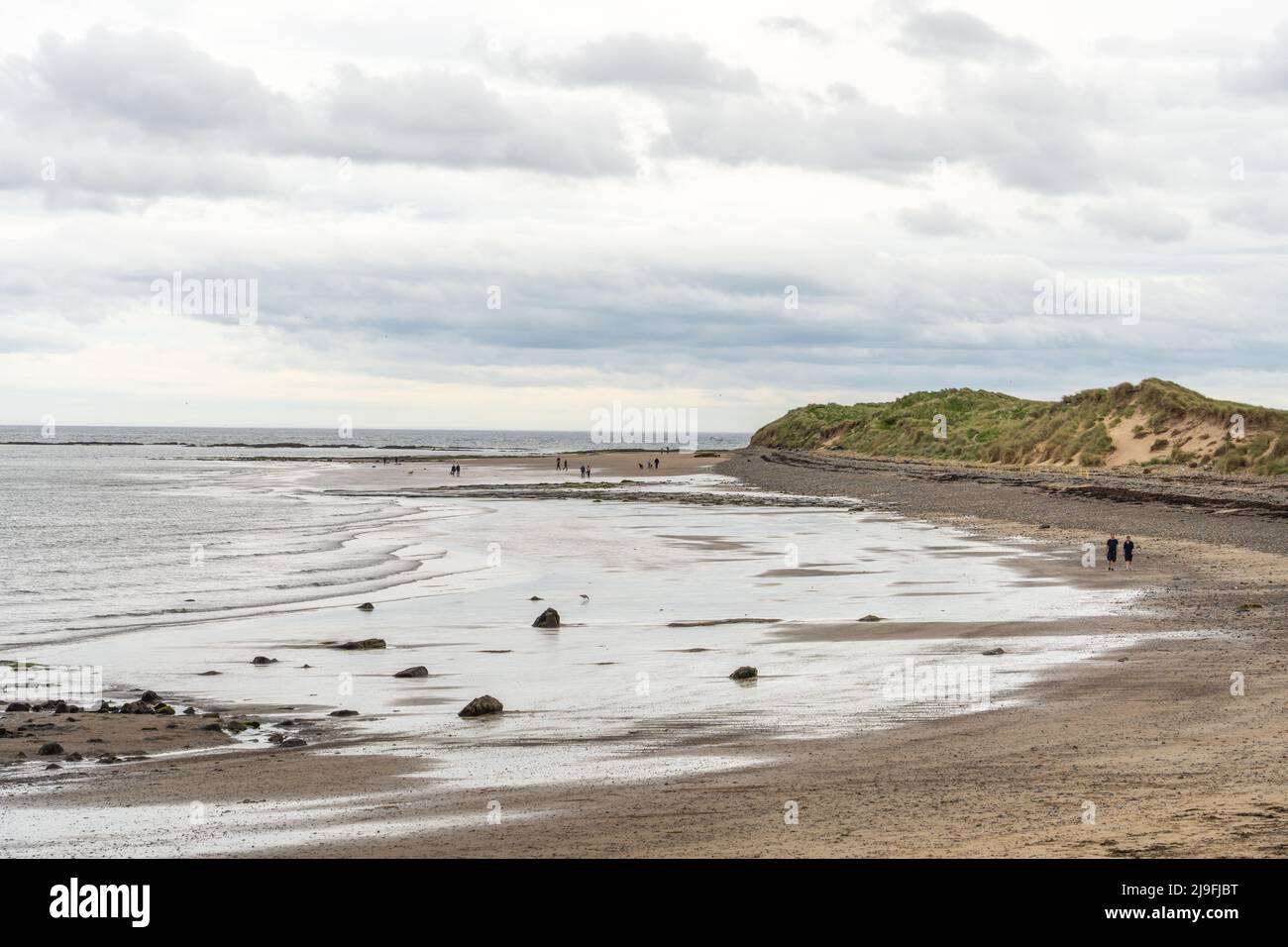 The View At Amble Links Beach Northumberland UK With People Taking A 