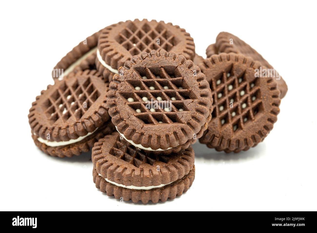 Cocoa biscuits with cream filling on a white background. close up Stock Photo