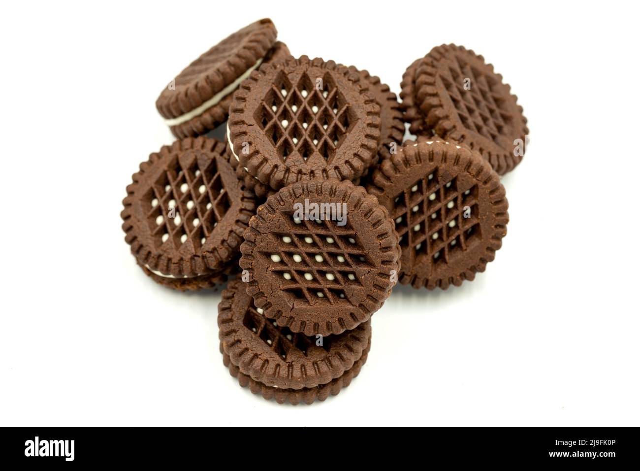 Cocoa biscuits with cream filling on a white background. close up Stock Photo