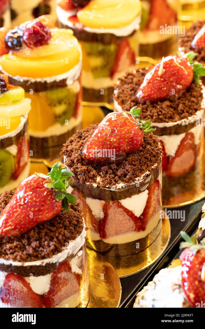 Much Cake Types of cakes. Cakes on display at the patisserie counter. close up ...