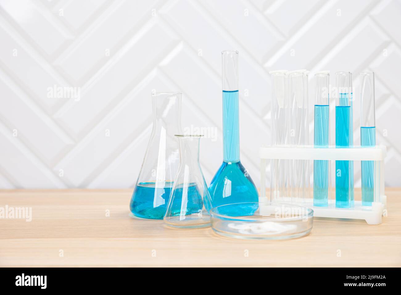 Laboratory glassware with test tubes. flasks, dropper, petri dishes