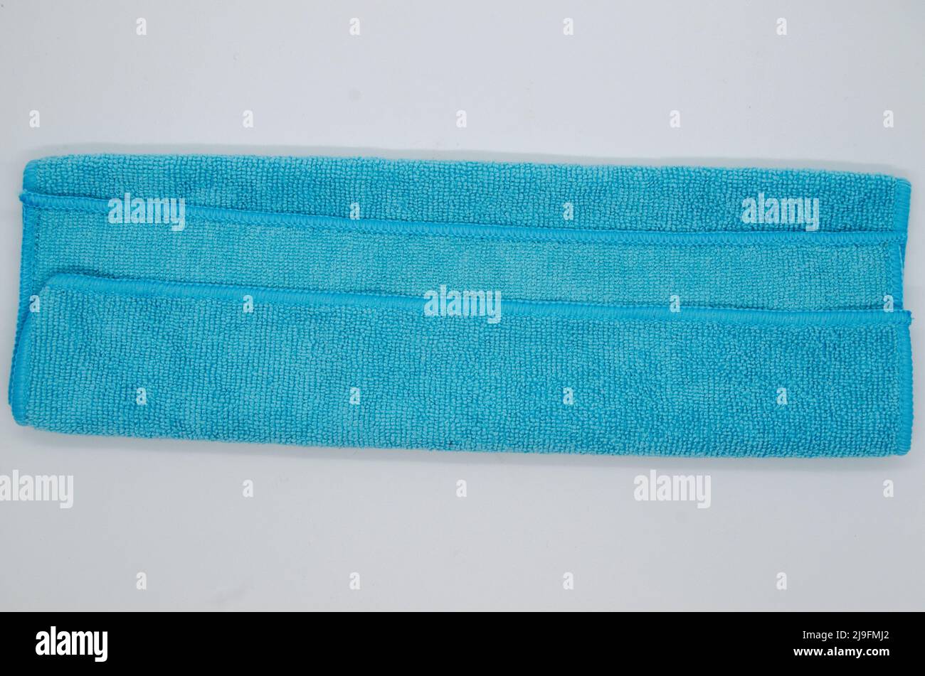 isolated-soft-fluffy-clean-folded-blue-towel-on-white-background
