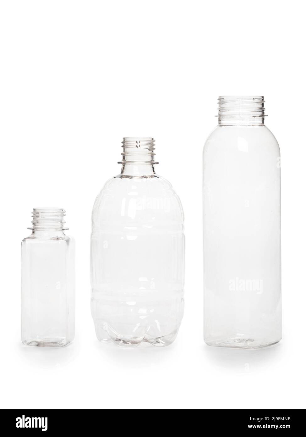 three different empty plastic bottles isolated on white background