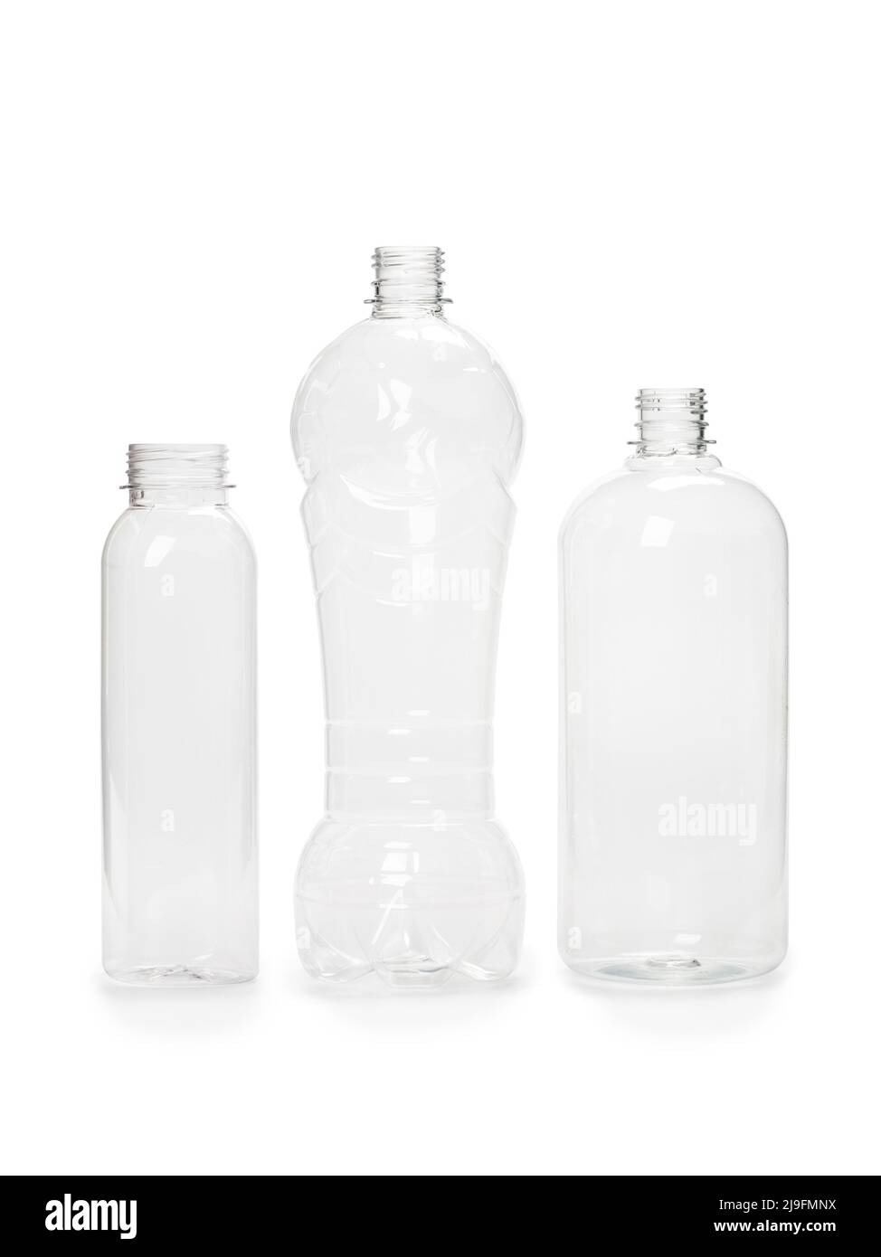 three different empty plastic bottles isolated on white background