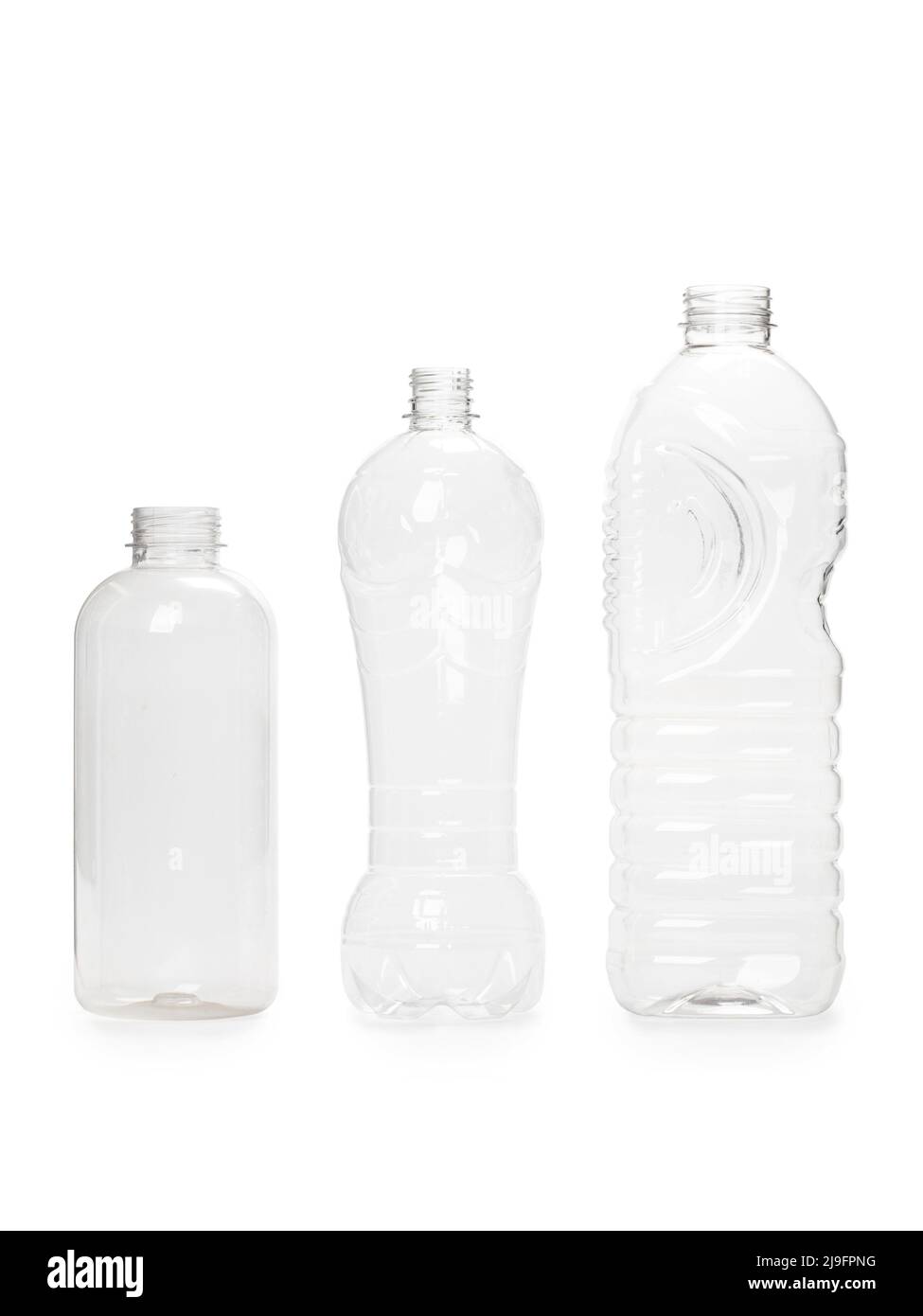 three different empty plastic bottles isolated on white background