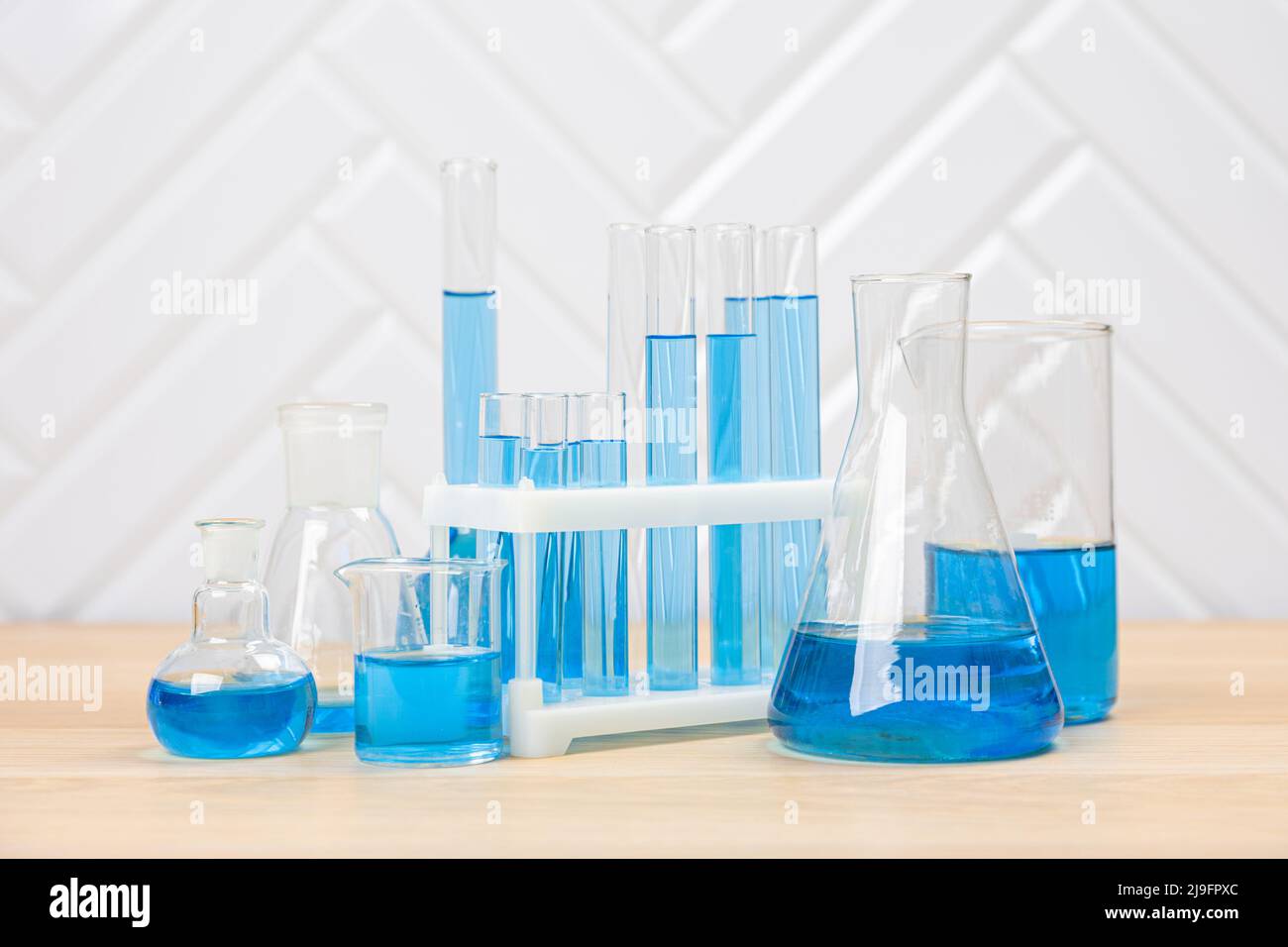 Laboratory glassware with test tubes. flasks, dropper, petri dishes