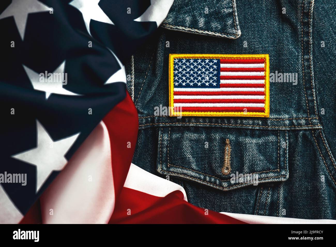 Happy Independence day July 4th. American flag textile patch on a denim jacket and American flag. Celebrating Independence Day concept Stock Photo