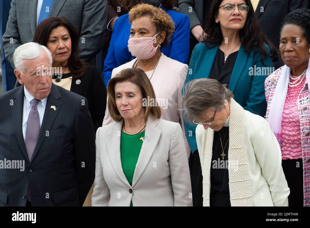 United States House Majority Leader Steny Hoyer (Democrat of Maryland), left, Speaker of the United States House of Representatives Nancy Pelosi (Democrat of California), center, and Bishop Mariann Edgar Budde of the Episcopal Diocese of Washington, right, lead a fraction of the Democratic members of the House of Representatives during a Moment of Silence for the One Million American Lives Lost to COVID-19, on the East Front Center Steps at the US Capitol in Washington, DC, Thursday, May 12, 2022. Credit: Rod Lamkey/CNP Stock Photo