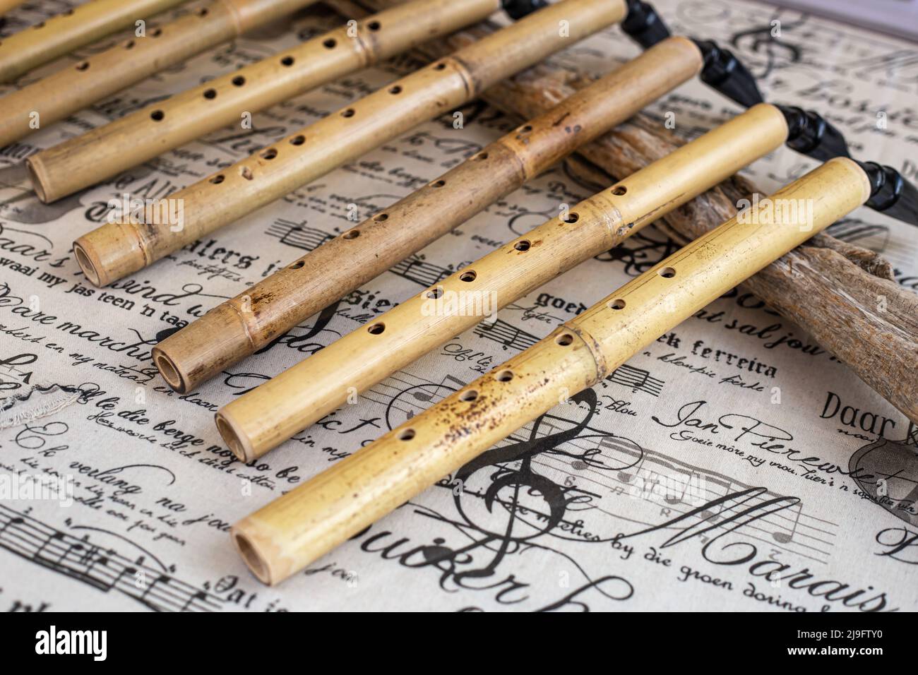 Woodwind musical instrument, handmade wooden saxophone, Stock