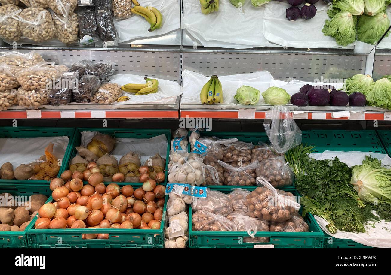 Vegetable and fruit aisle, raw tomatoes, lemons, citrus fruits, red