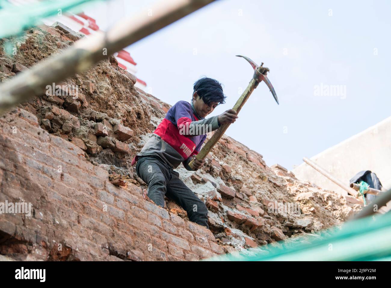 Kathmandu, Nepal- April 20,2022 : Local people of all ages and genders are working to rebuild the ruined old city in a major earthquake in Kathmandu. Stock Photo