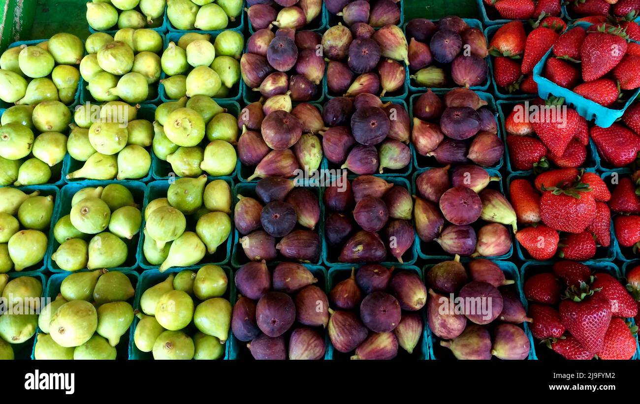 Vegetable and fruit aisle, raw tomatoes, lemons, citrus fruits, red