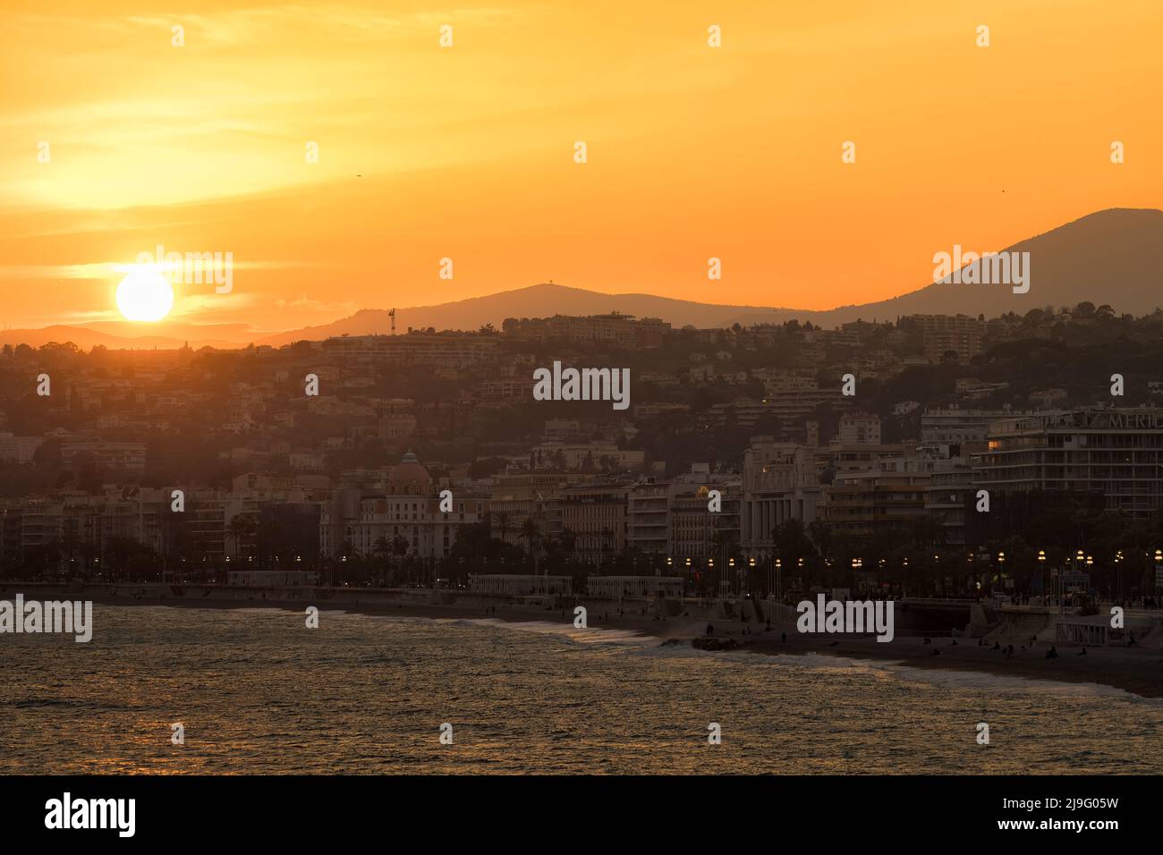 Nice, France - The city of Nice and its iconic Promenade des Anglais at sunset Stock Photo