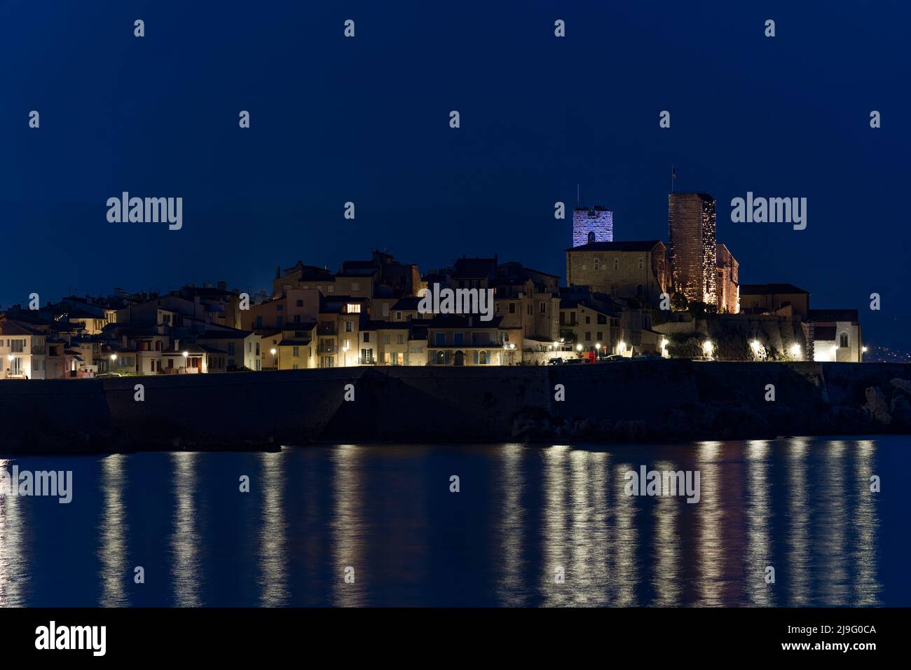 View of sea port in Cannes,France and its old town at night Stock Photo