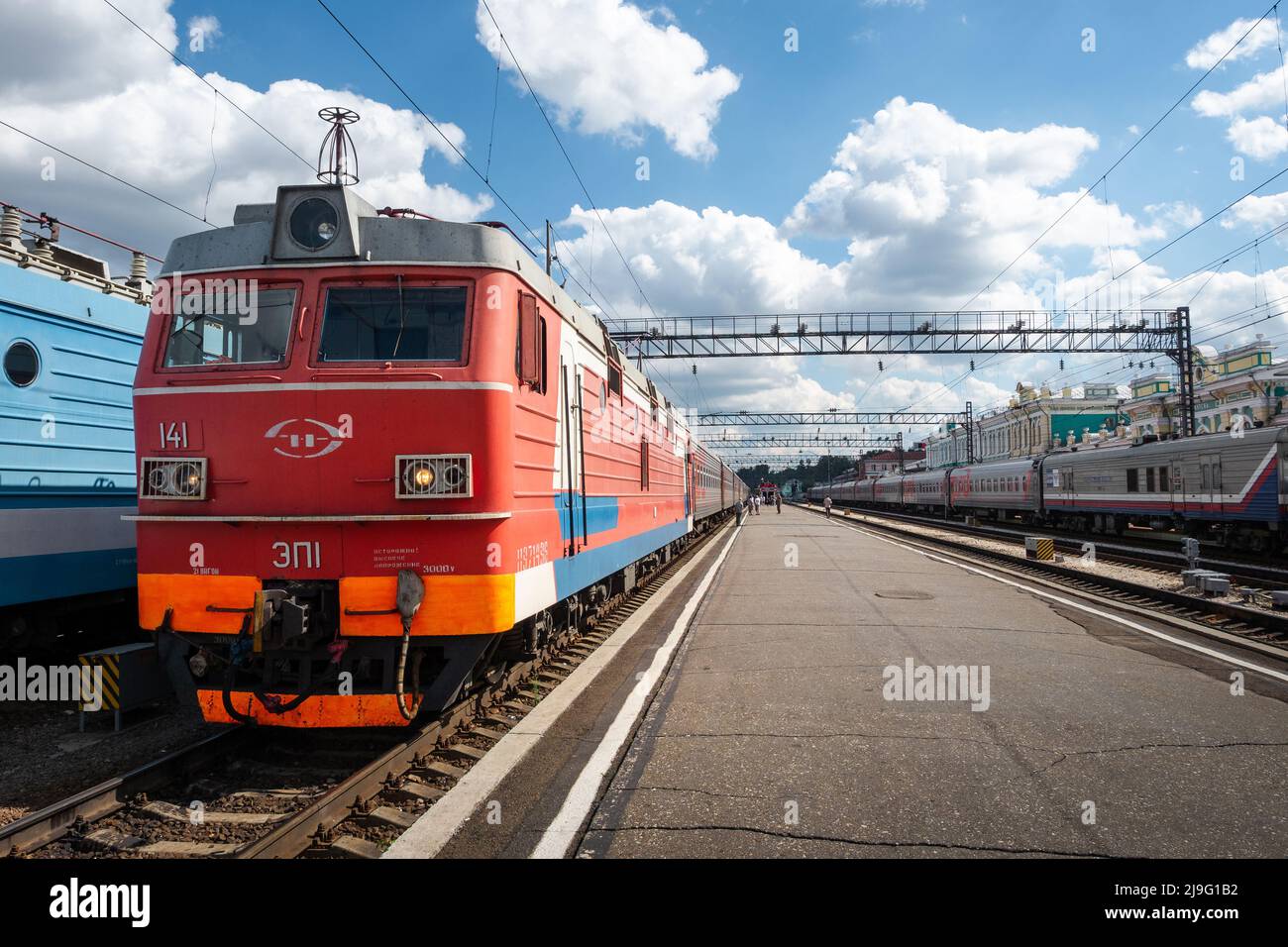 Trains at the Irkutsk-Passazhirsky railway station in the city of Irkutsk in Russia, an important stop along the Trans-Siberian Railway. Stock Photo