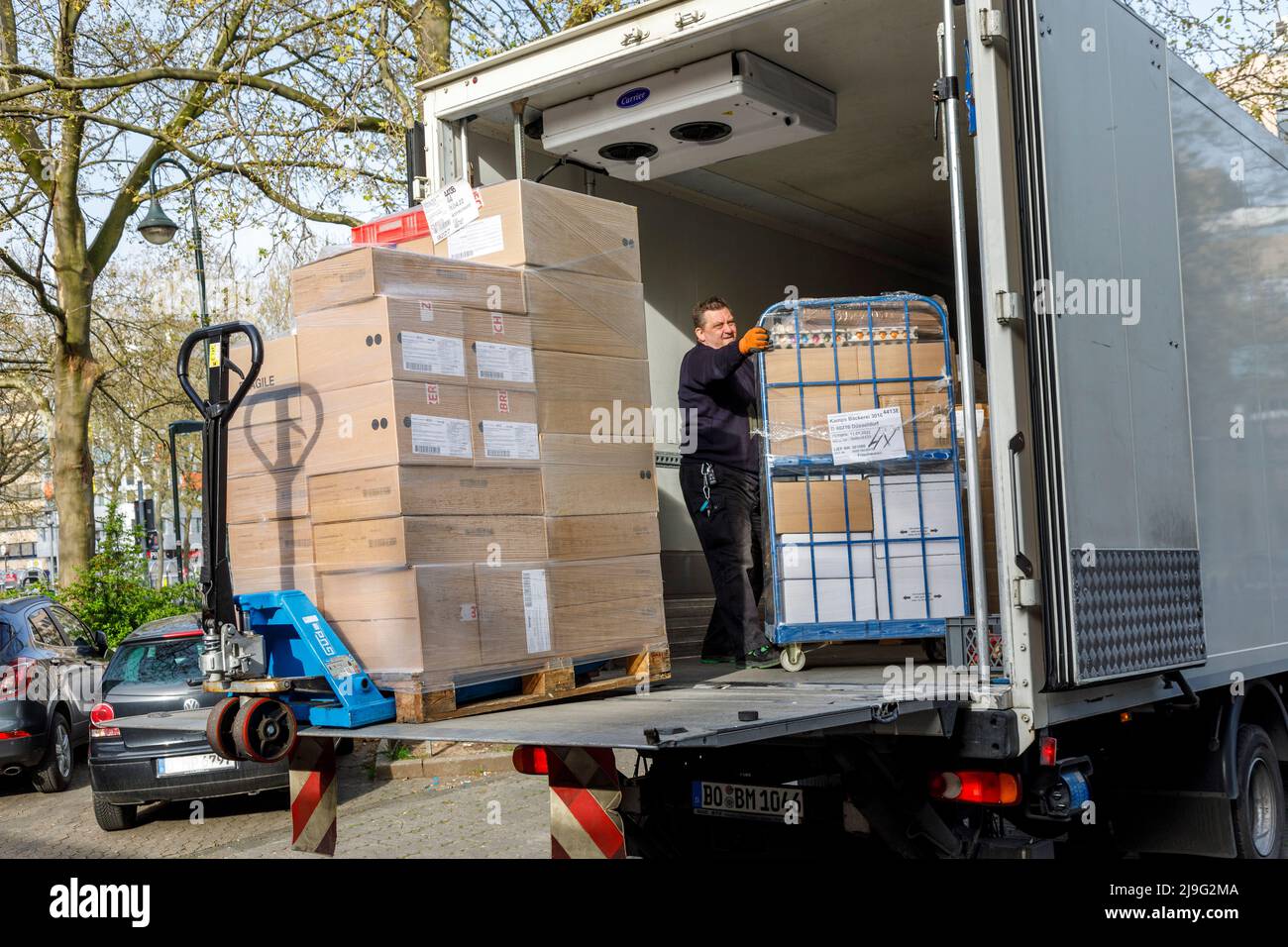 Local delivery traffic, unloading of frozen goods at Dusseldorf main station Stock Photo