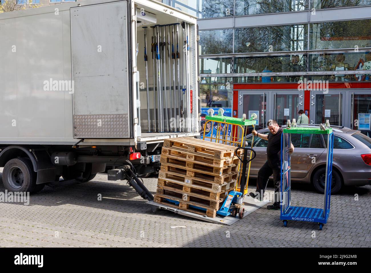 Local delivery traffic, unloading of frozen goods at Dusseldorf main station Stock Photo