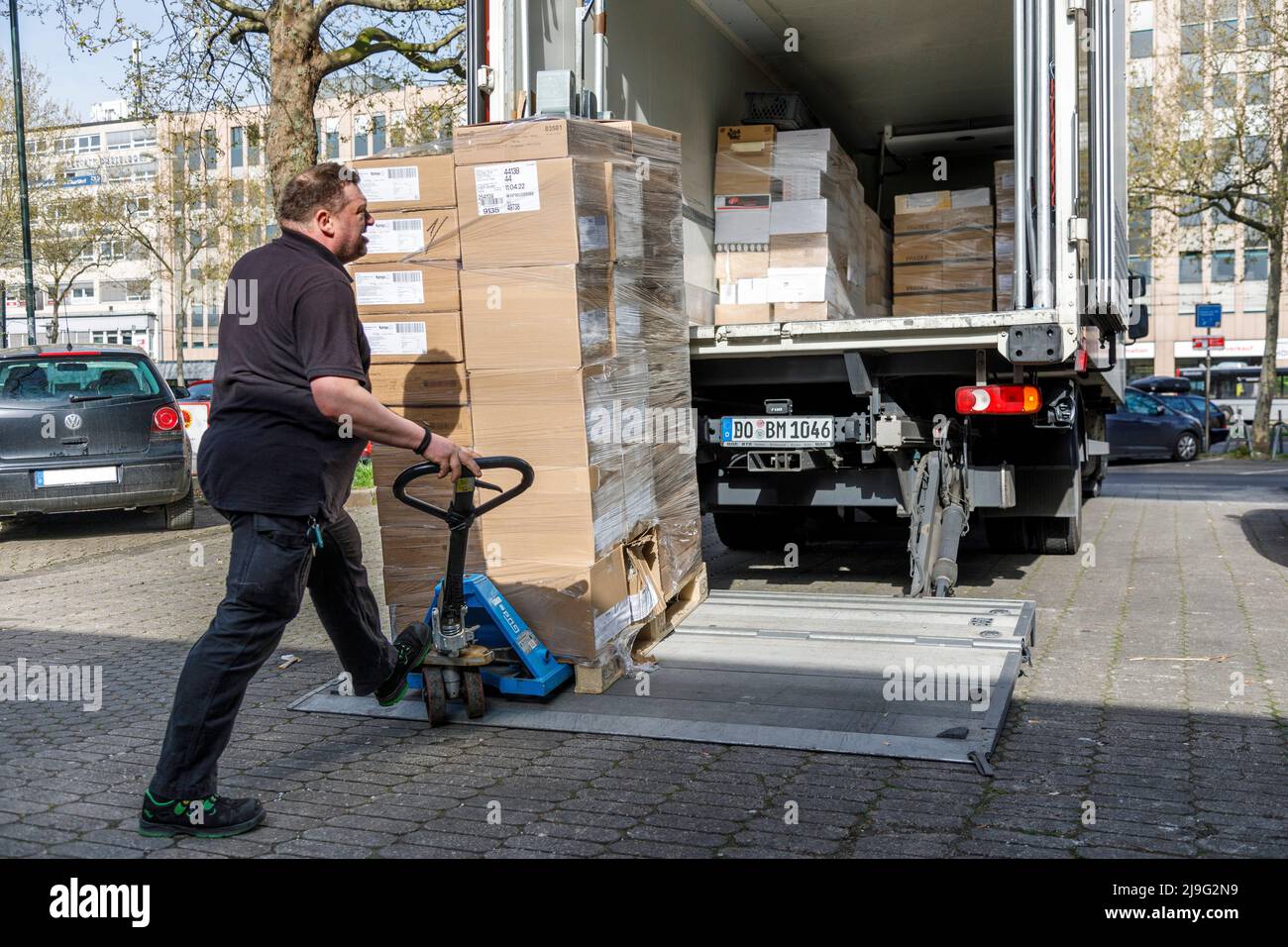 Local delivery traffic, unloading of frozen goods at Dusseldorf main station Stock Photo