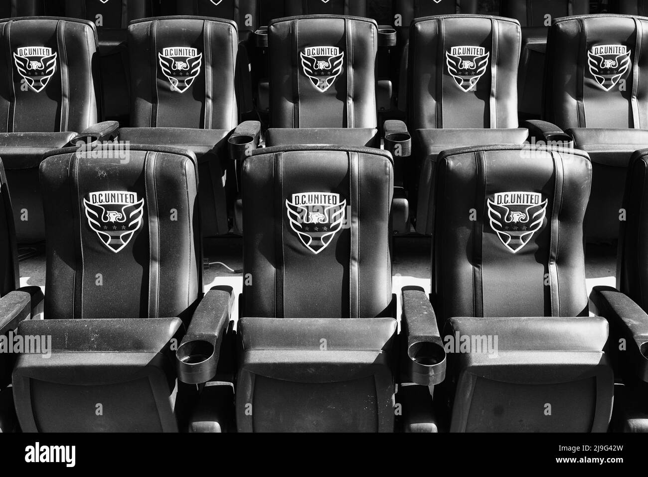 Padded stadium seating at a soccer stadium Stock Photo