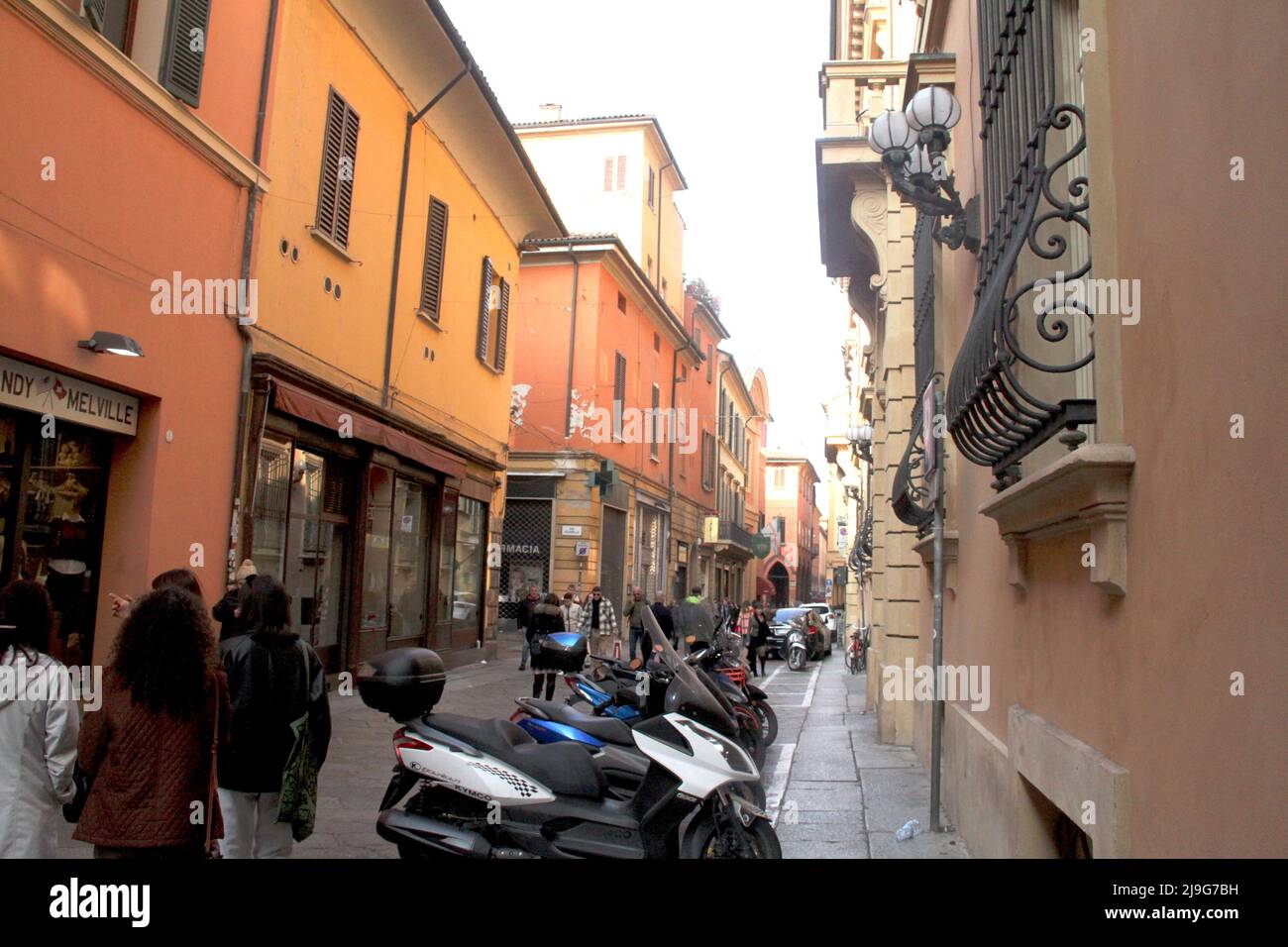 Bologna, Italy. Alley in the historic center with parking space for scooters and motorcycles