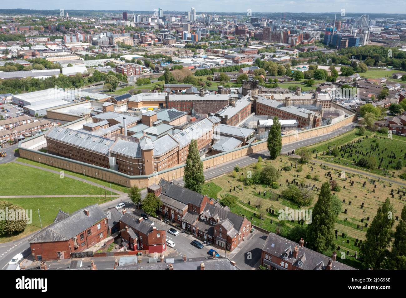 Aerial drone photo of the town of Armley in Leeds West Yorkshire in the UK, showing the famous HM Prison Leeds, or Armley Prison, showing the Jail wal Stock Photo