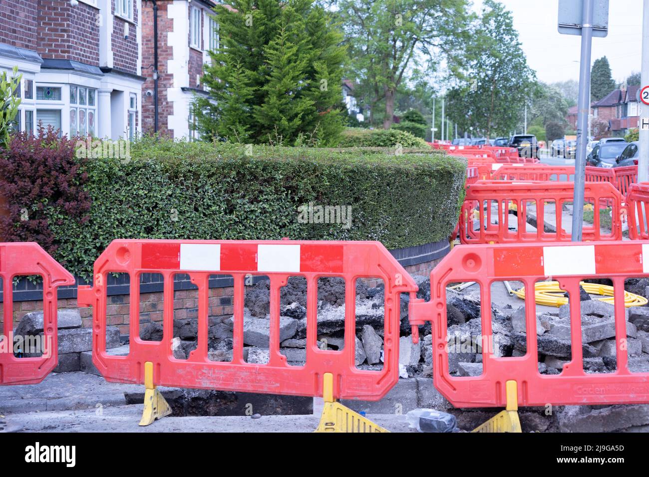 pavement barrier to stop people falling into hole Stock Photo