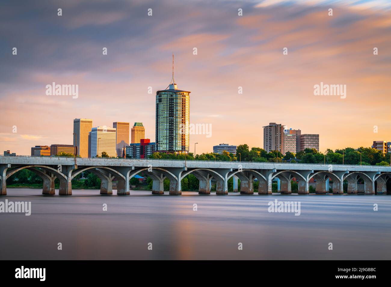 Tulsa, Oklahoma, USA downtown skyline on the Arkansas River at dusk. Stock Photo