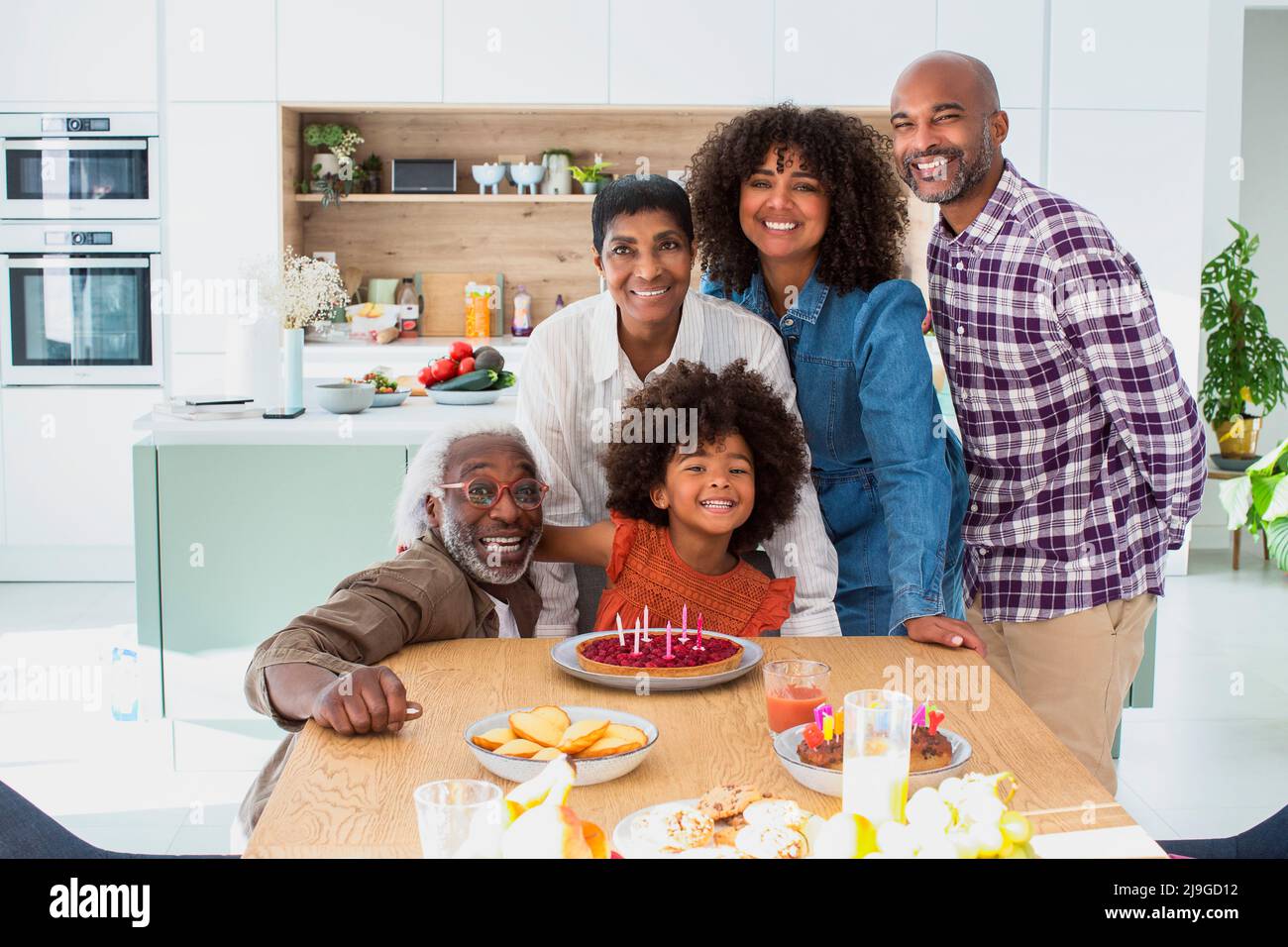 Happy family celebrating birthday at home Stock Photo