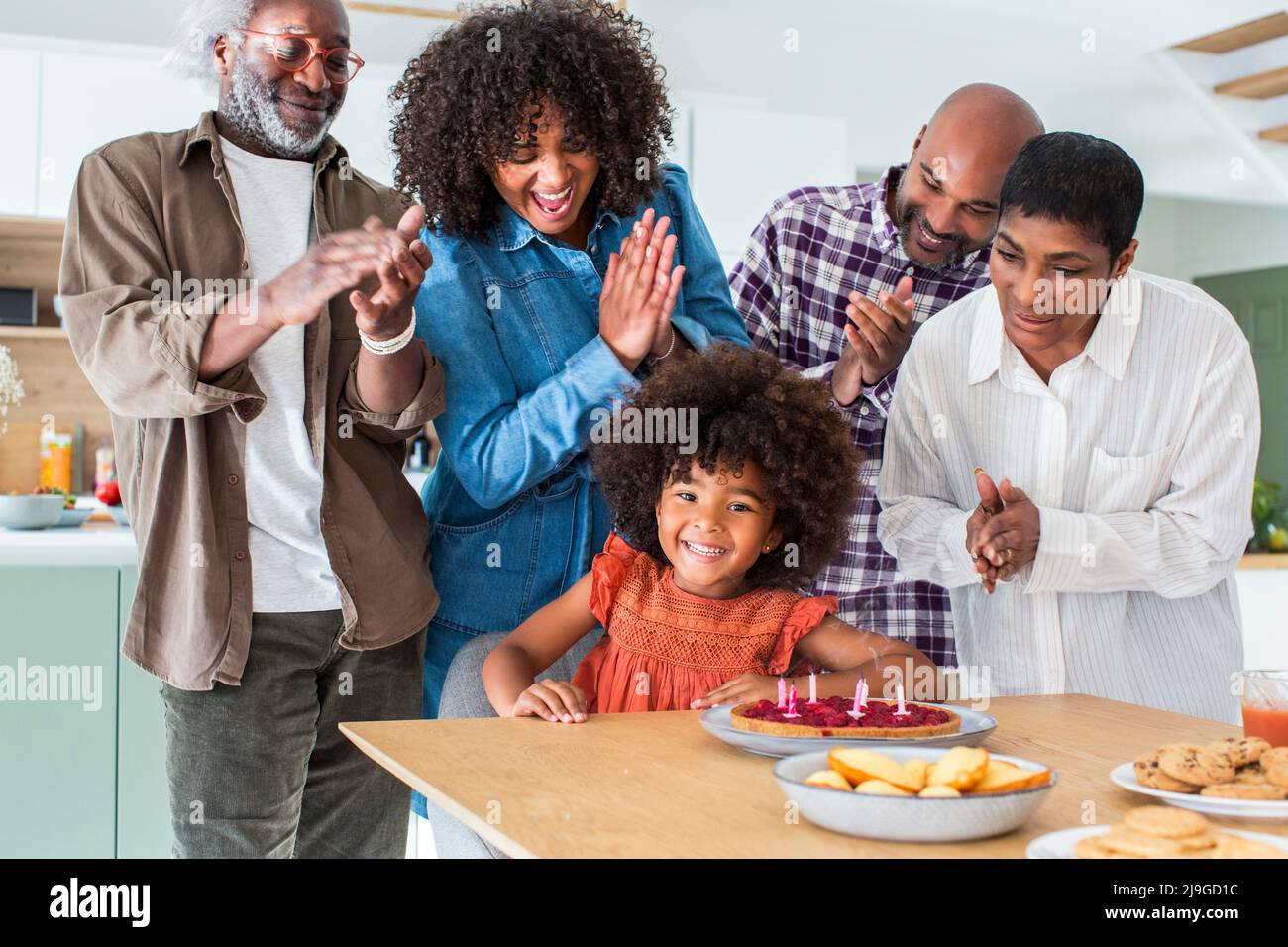 Happy family celebrating birthday at home Stock Photo