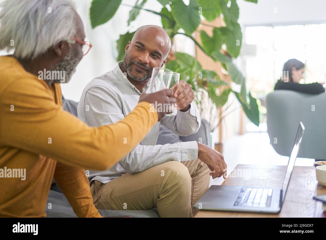 Father and son toasting Stock Photo - Alamy