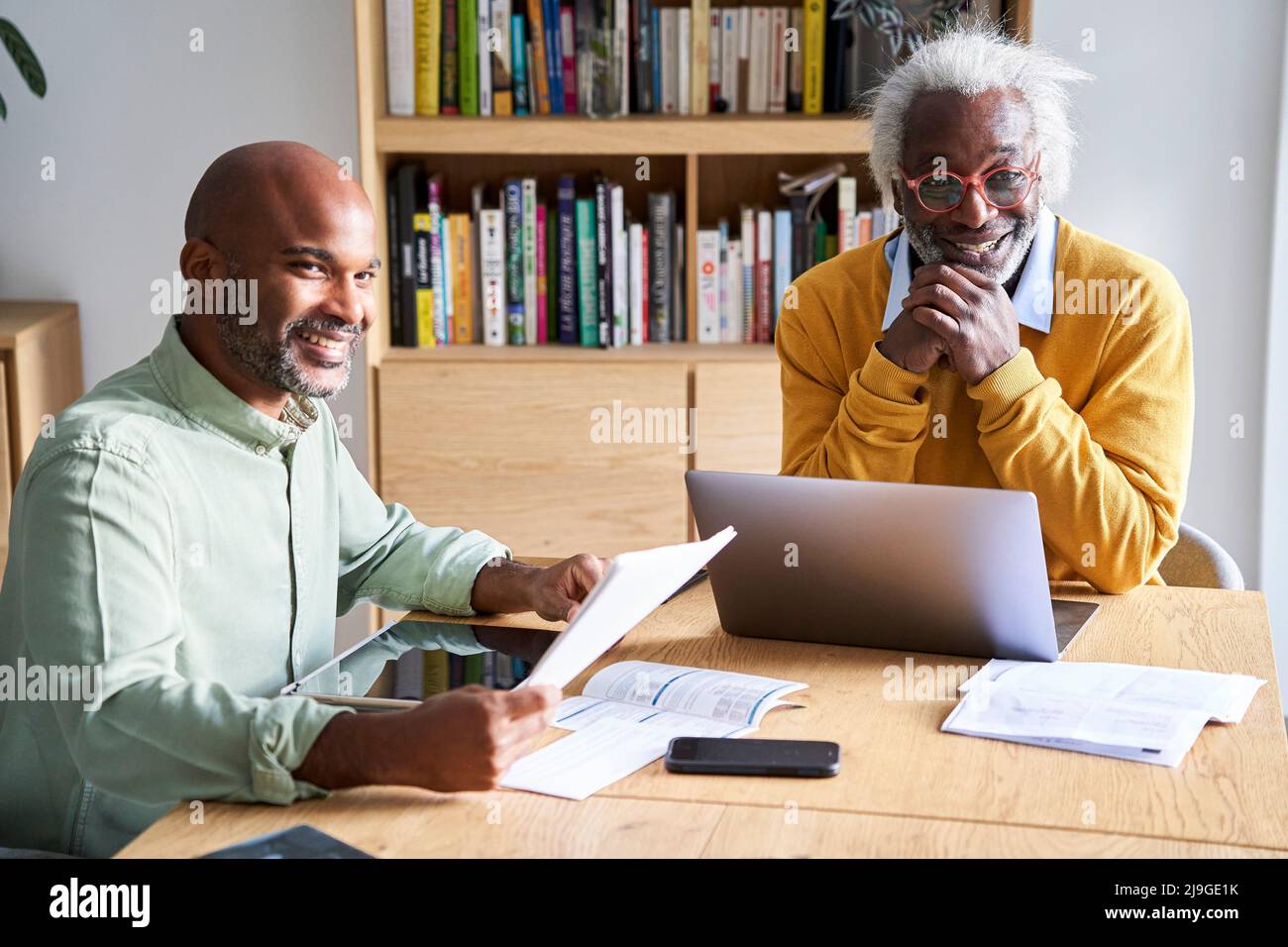 Father and son discussing with each other at home Stock Photo